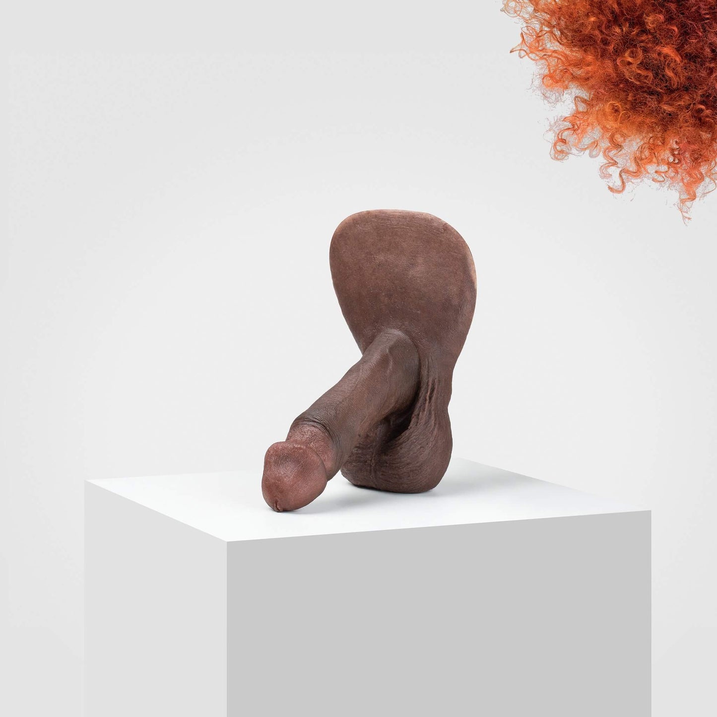 Emisil ultra-realistic FTM packer model in brown, displayed on a white pedestal.