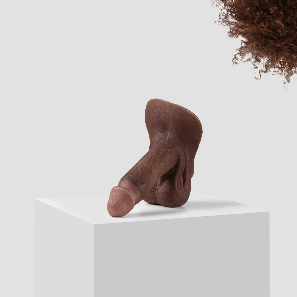Emisil ER09 FTM pack and play prosthetic in skin shade S11 with brown hair