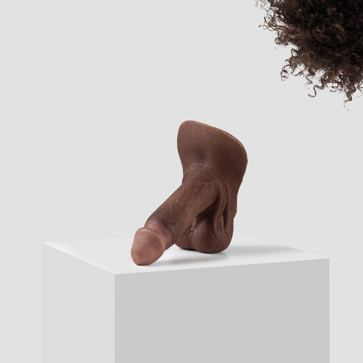 Emisil ER09 FTM pack and play prosthetic in skin shade S11 with dark brown hair