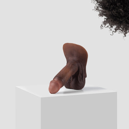 Emisil ER09 FTM pack and play prosthetic in skin shade S13 with black hair
