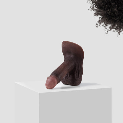 Emisil ER09 FTM pack and play prosthetic in skin shade S16 with black hair