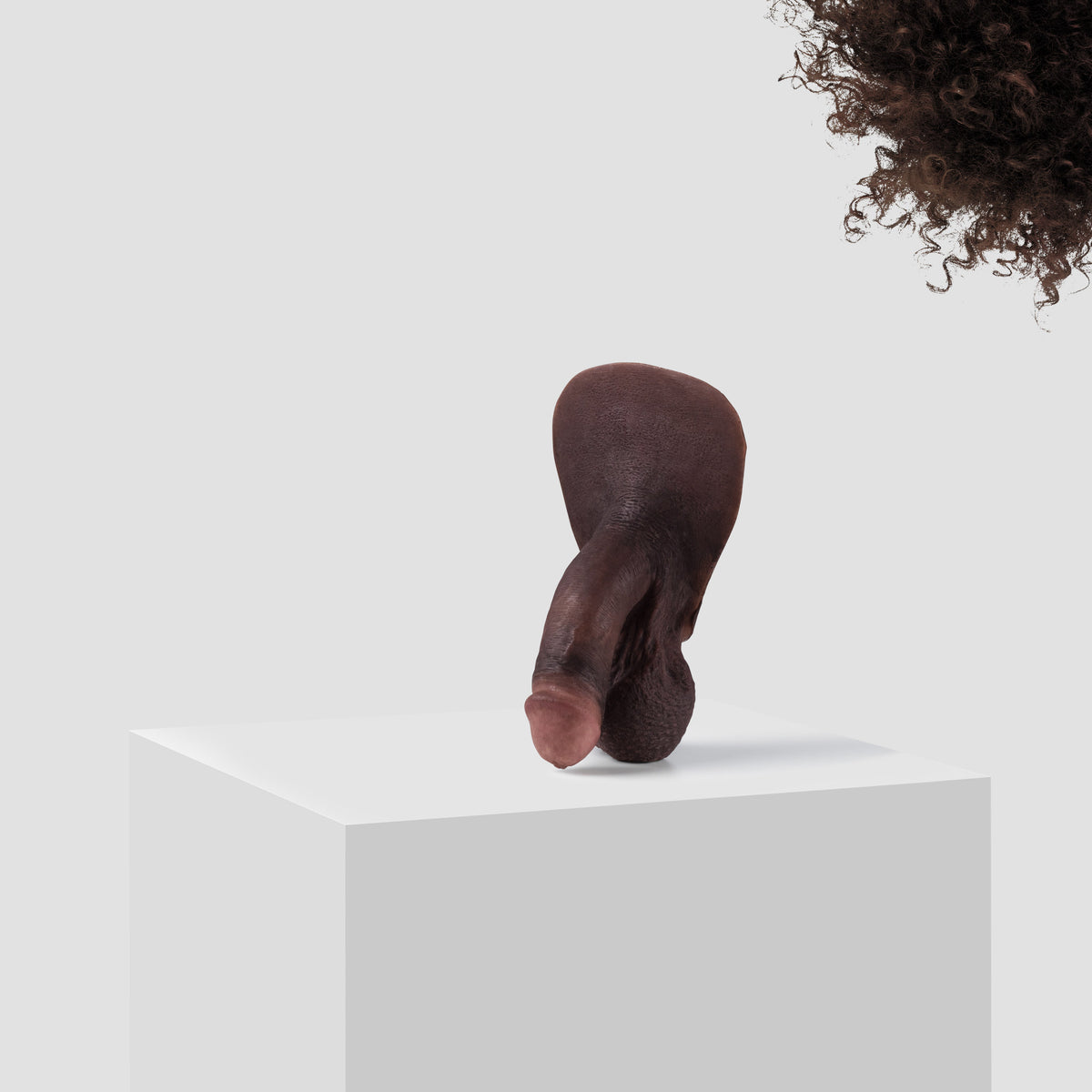 Emisil FL03 soft FTM packer in skin shade S16 with dark brown hair